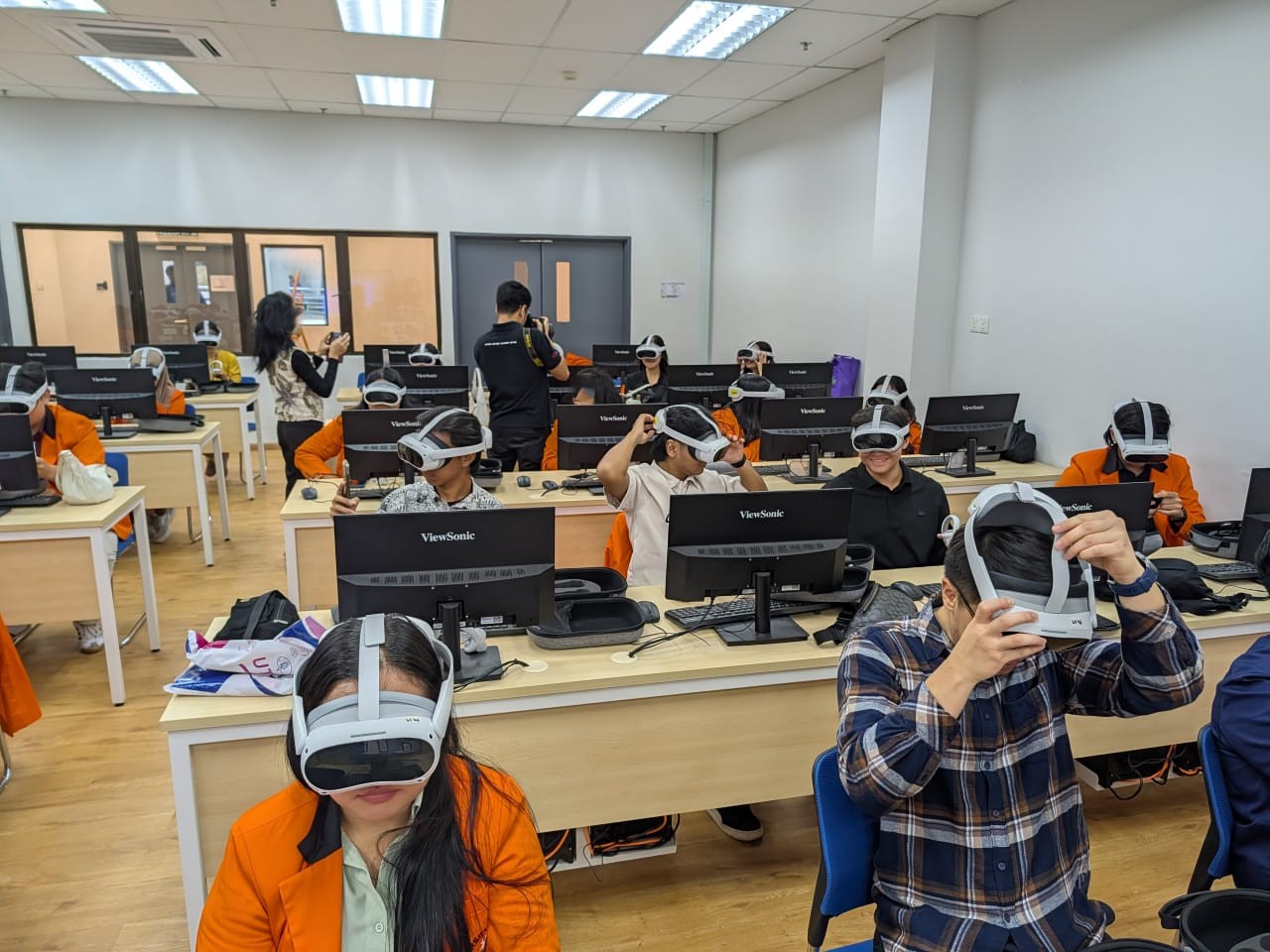 Instructor supporting learners during a VR classroom session